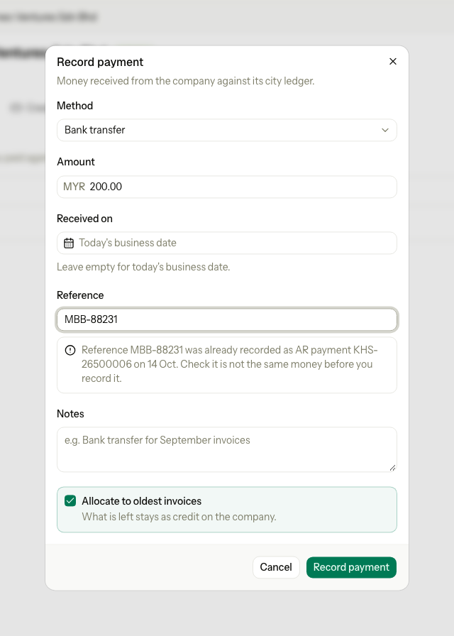 The Record payment dialog with a warning that the reference was already recorded